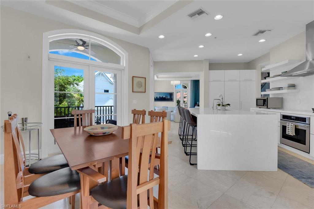 684 10th Avenue South, Unit D1 Naples, FL 34102 - Photo 11 of 45 a view of kitchen with dining area
