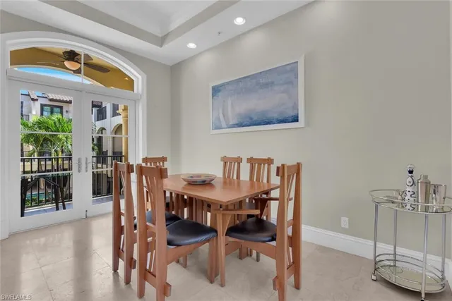 a view of a dining room with furniture and window