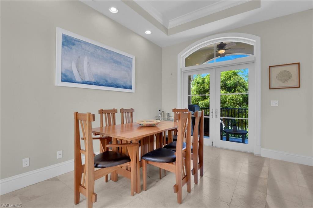 684 10th Avenue South, Unit D1 Naples, FL 34102 - Photo 13 of 45 a view of a dining room with furniture window and outside view