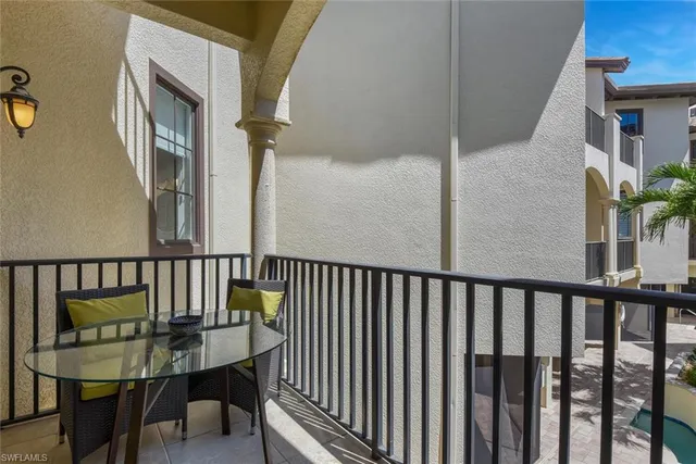 a view of a balcony having furniture