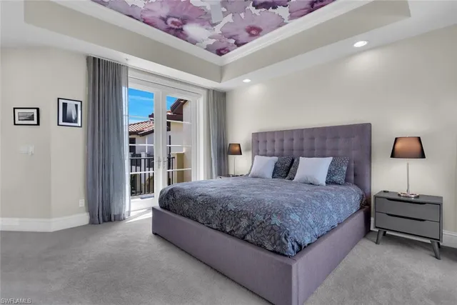 a spacious bedroom with a bed and a walk in closet