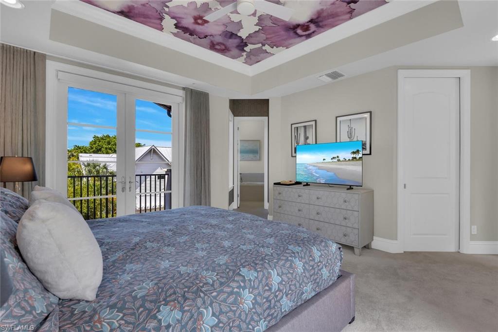 684 10th Avenue South, Unit D1 Naples, FL 34102 - Photo 20 of 45 a bedroom with a bed and a window