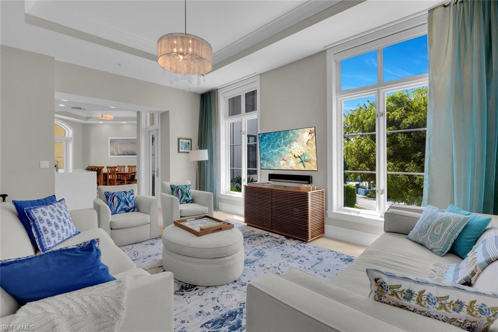 684 10th Avenue South, Unit D1 Naples, FL 34102 - Photo 2 of 45 a living room with furniture and a large window