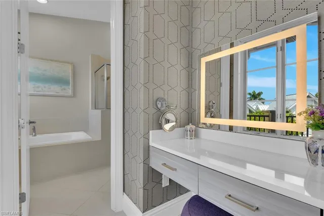 a bathroom with a bathtub and a sink