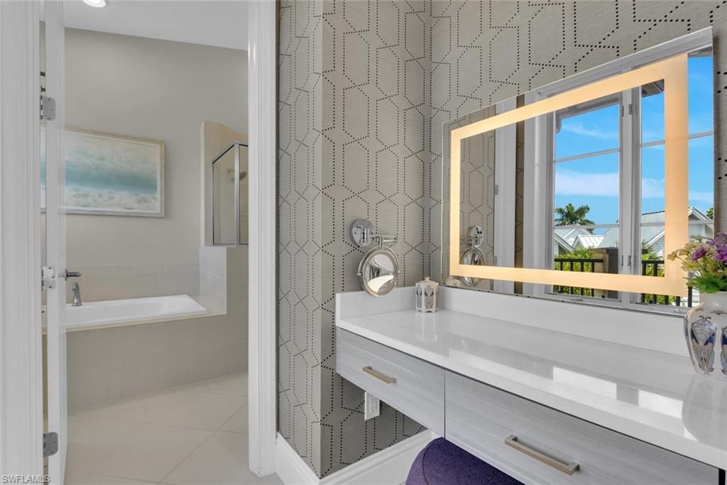 684 10th Avenue South, Unit D1 Naples, FL 34102 - Photo 22 of 45 a bathroom with a bathtub and a sink