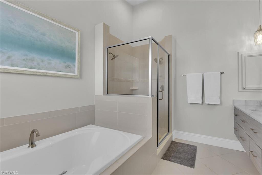 684 10th Avenue South, Unit D1 Naples, FL 34102 - Photo 24 of 45 a bathroom with a bathtub and a shower
