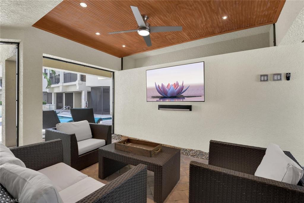 684 10th Avenue South, Unit D1 Naples, FL 34102 - Photo 33 of 45 a living room with furniture and a ceiling fan