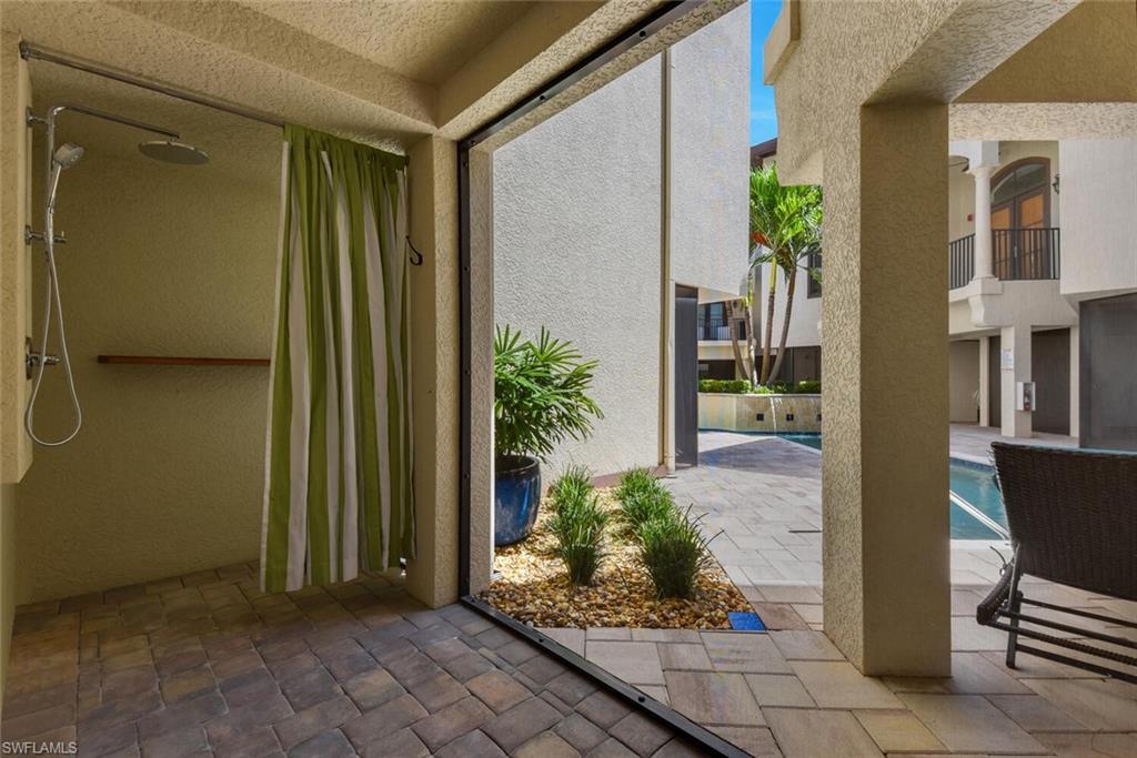 684 10th Avenue South, Unit D1 Naples, FL 34102 - Photo 37 of 45 a front view of a house with garden