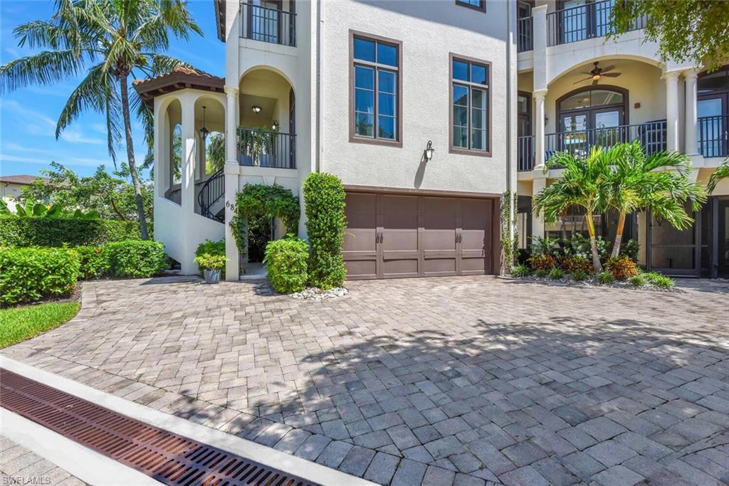 684 10th Avenue South, Unit D1 Naples, FL 34102 - Photo 42 of 45 a front view of a house with garden