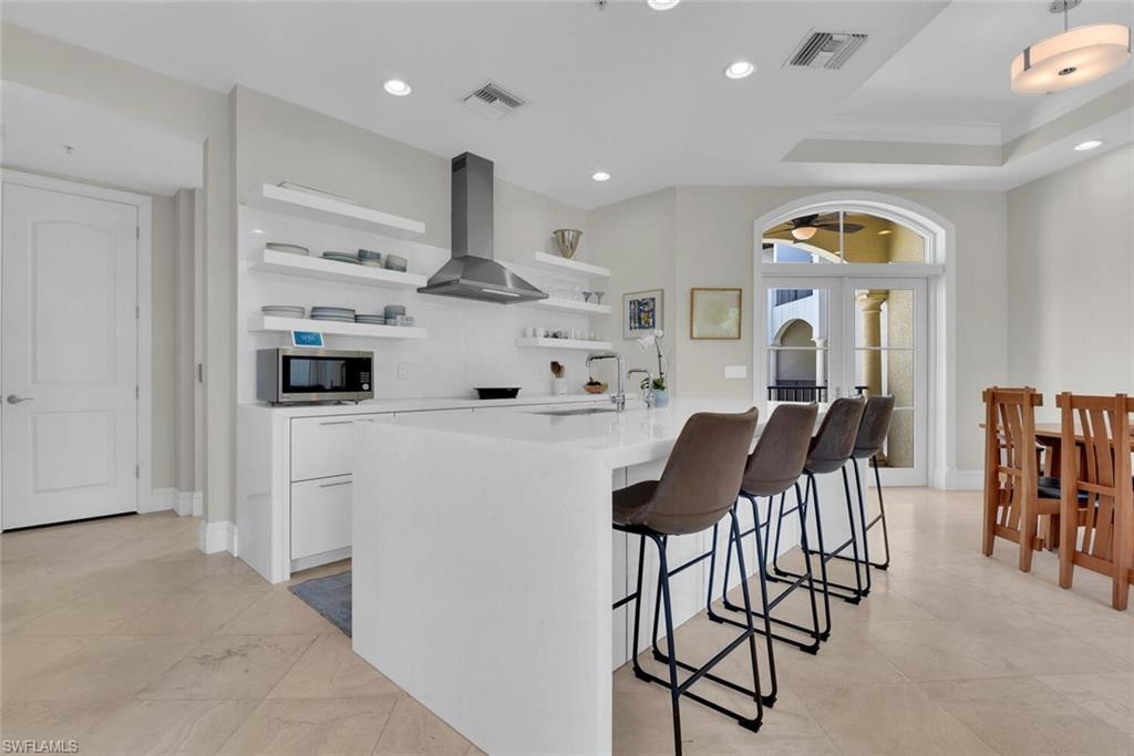 684 10th Avenue South, Unit D1 Naples, FL 34102 - Photo 6 of 45 a view of kitchen with furniture and wooden floor