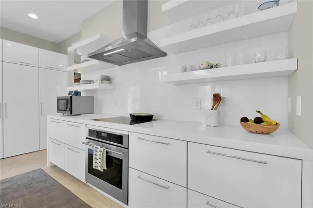 a kitchen with a stove and cabinets