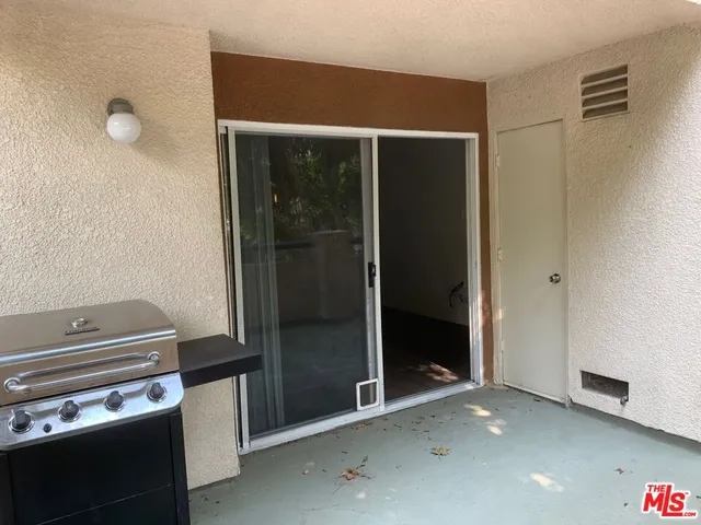a kitchen with a refrigerator and a stove