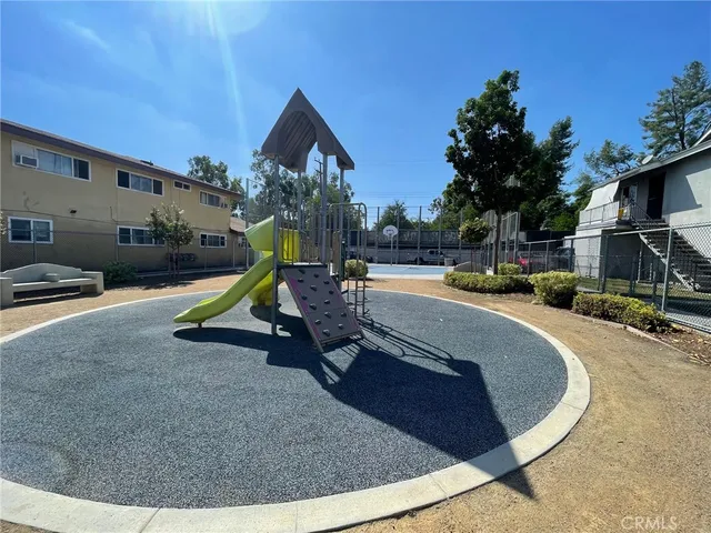 a view of a park with swings