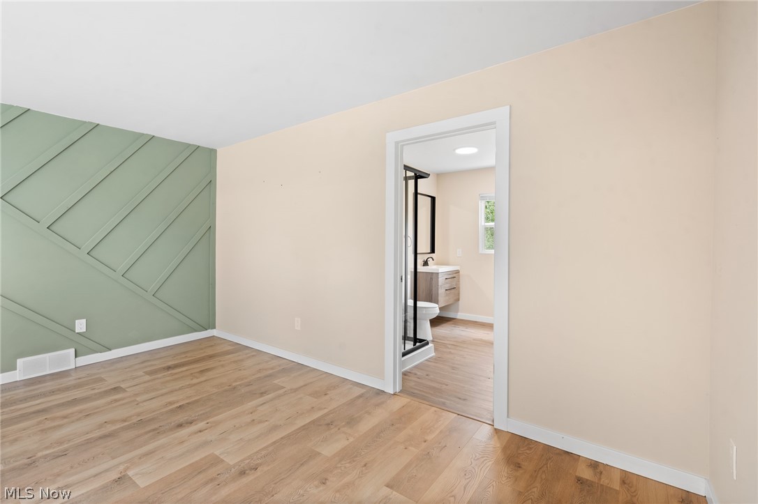 1617 Graham Road Stow, OH 44224 - Photo 15 of 49 Unfurnished bedroom with ensuite bath and light wood-type flooring