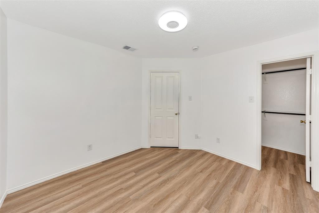 1006 Buckingham Drive Forney, TX 75126 - Photo 18 of 31 a view of empty room with wooden floor