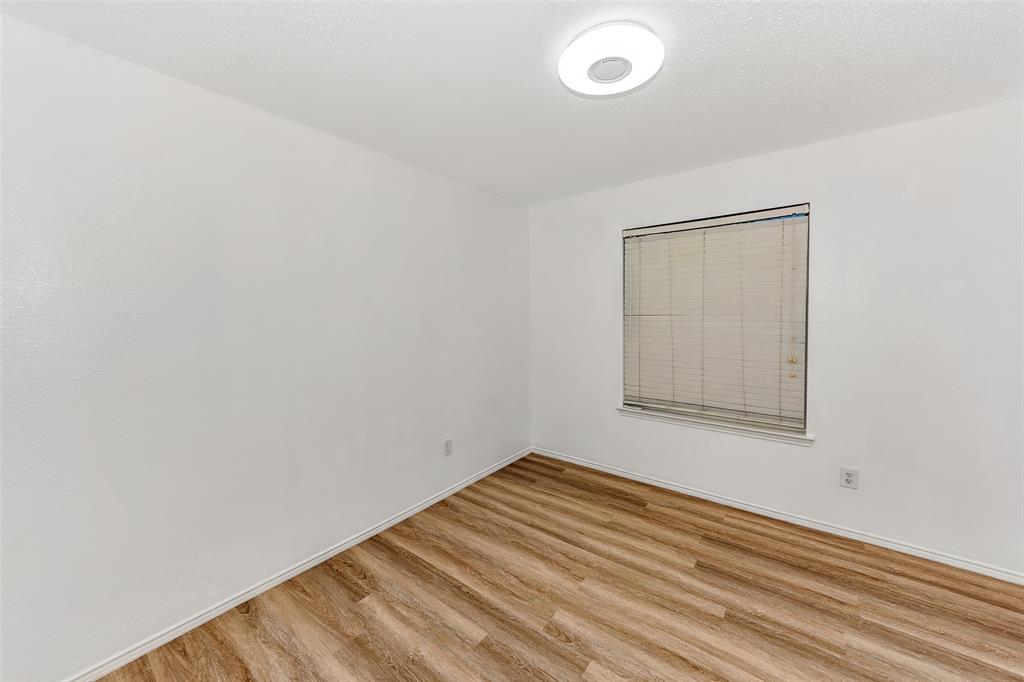 1006 Buckingham Drive Forney, TX 75126 - Photo 20 of 31 an empty room with a window