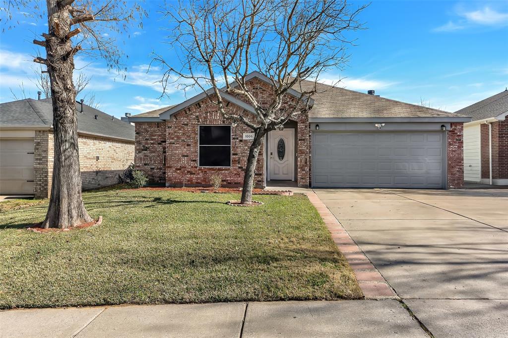 1006 Buckingham Drive Forney, TX 75126 - Photo 2 of 31 a front view of a house with garden