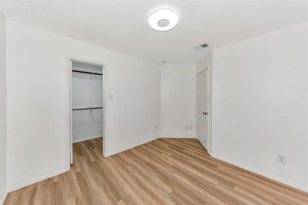 1006 Buckingham Drive Forney, TX 75126 - Photo 21 of 31 a view of empty room with wooden floor