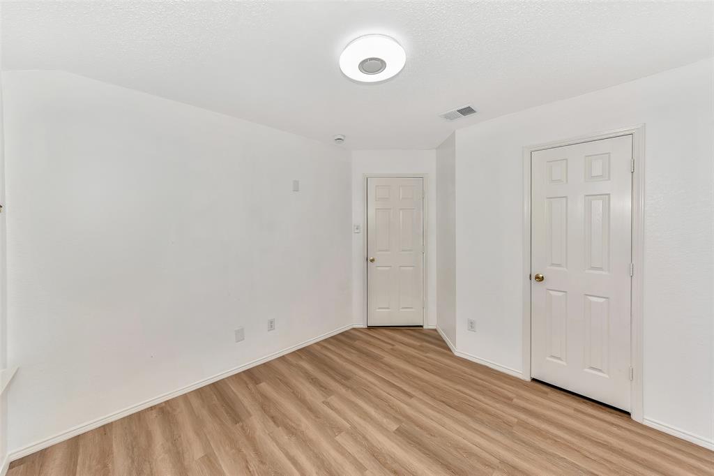 1006 Buckingham Drive Forney, TX 75126 - Photo 23 of 31 a view of empty room with wooden floor