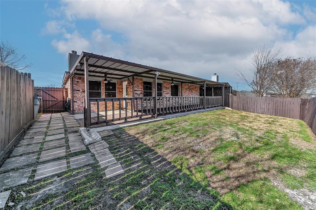 1006 Buckingham Drive Forney, TX 75126 - Photo 29 of 31 a view of a house with wooden fence