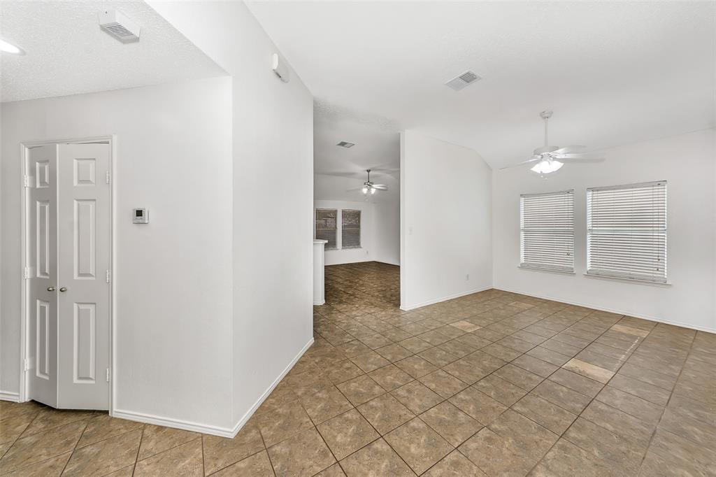 1006 Buckingham Drive Forney, TX 75126 - Photo 4 of 31 a view of empty room with wooden floor