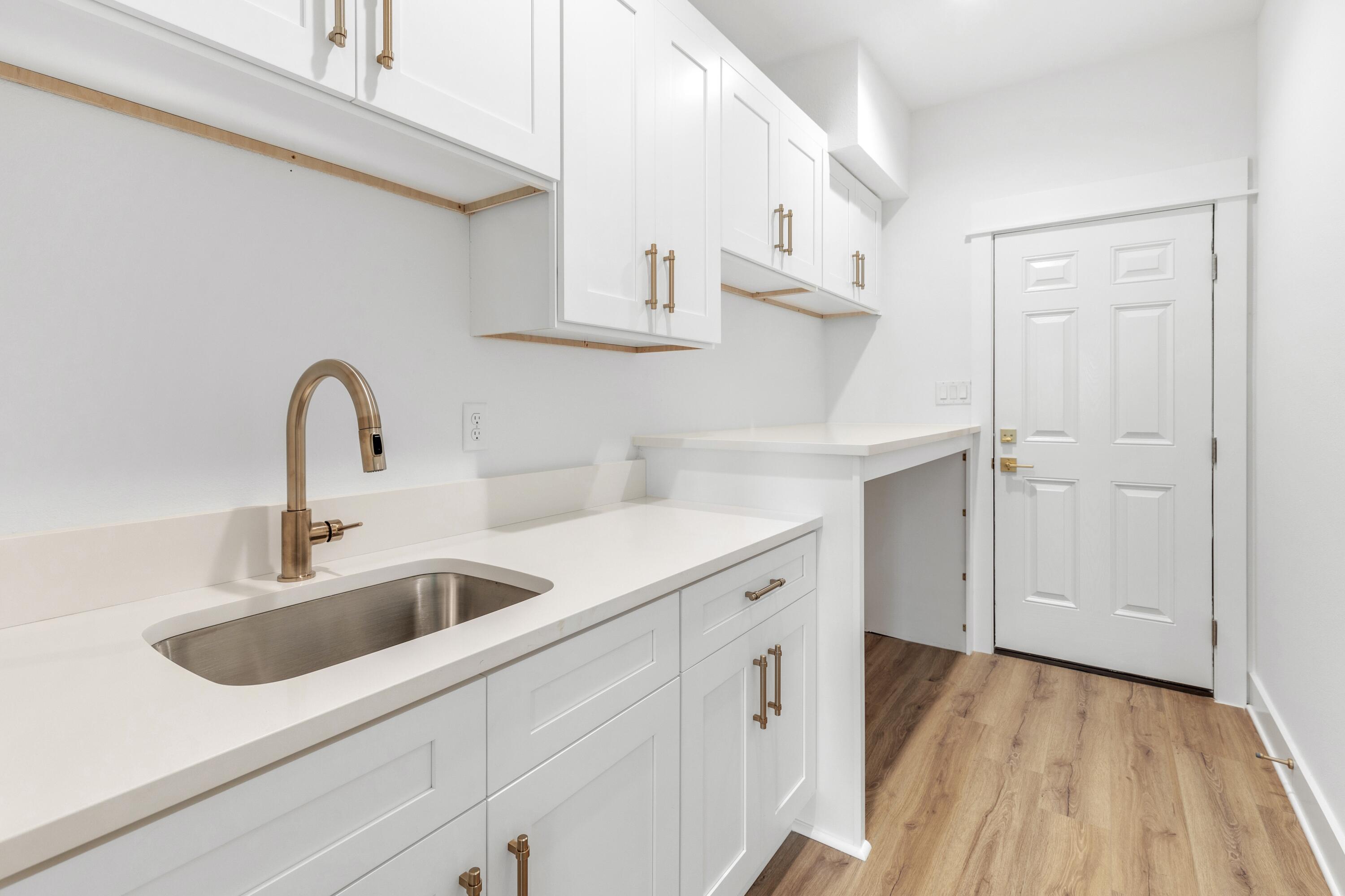 160 Clarke Hl Road Freeport, FL 32439 - Photo 12 of 34 a close view of a sink and dishwasher with white cabinets
