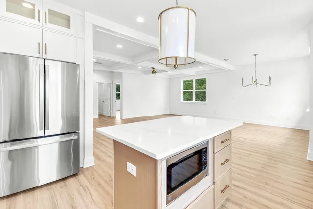a kitchen with a refrigerator and countertop