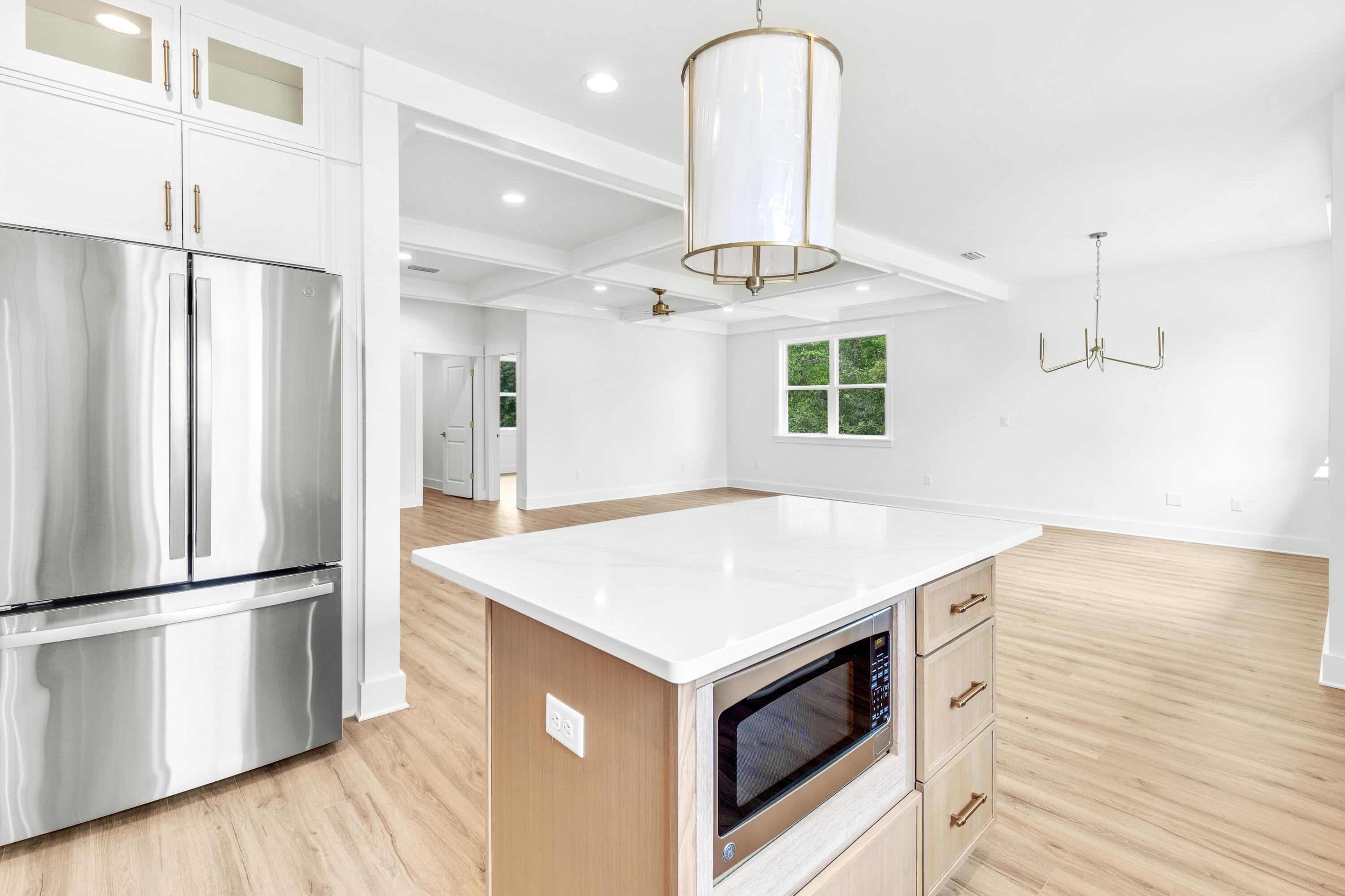 160 Clarke Hl Road Freeport, FL 32439 - Photo 3 of 34 a kitchen with a refrigerator and countertop