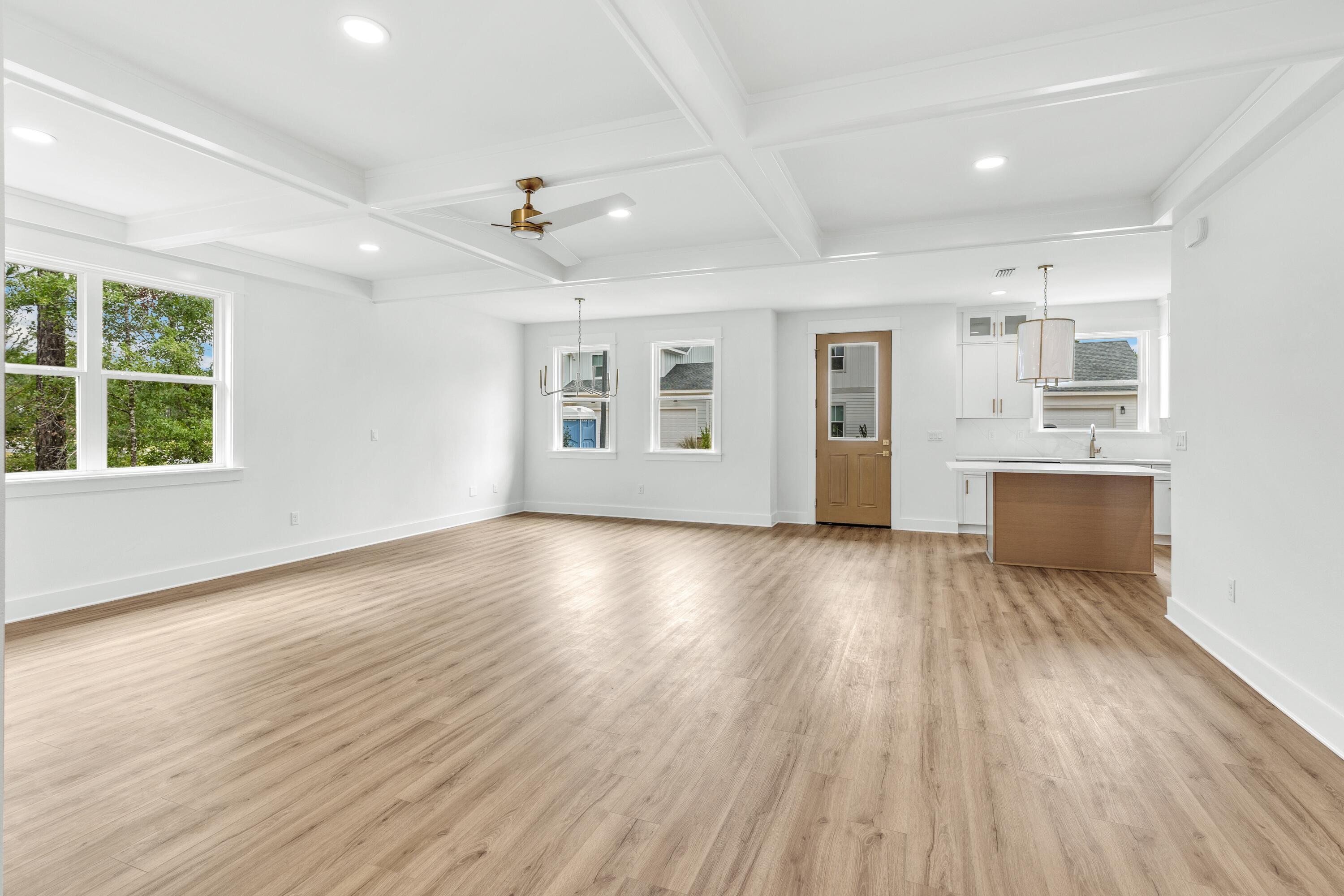 160 Clarke Hl Road Freeport, FL 32439 - Photo 5 of 34 a view of an empty room with a window and wooden floor