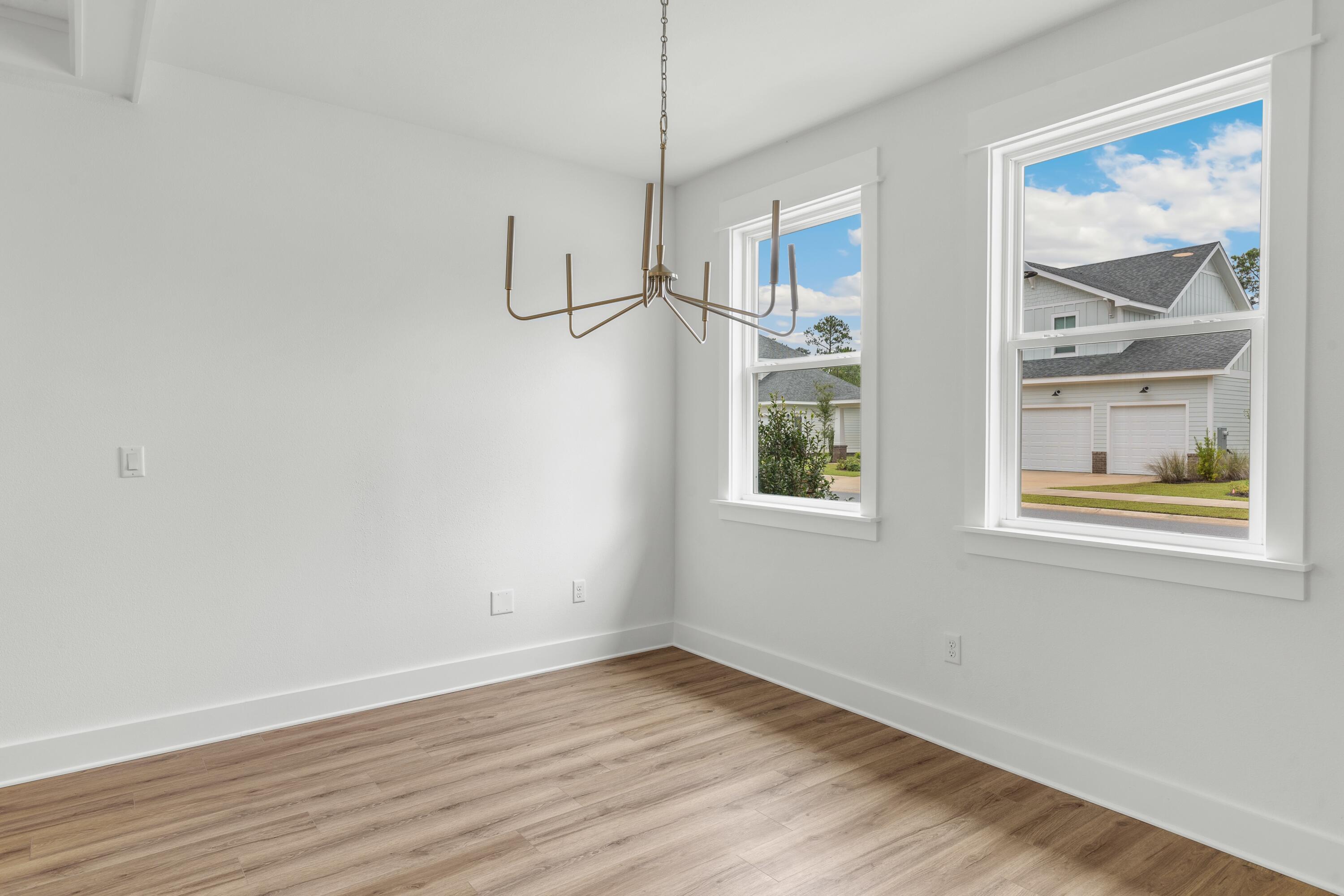 160 Clarke Hl Road Freeport, FL 32439 - Photo 6 of 34 a view of an empty room with wooden floor and window