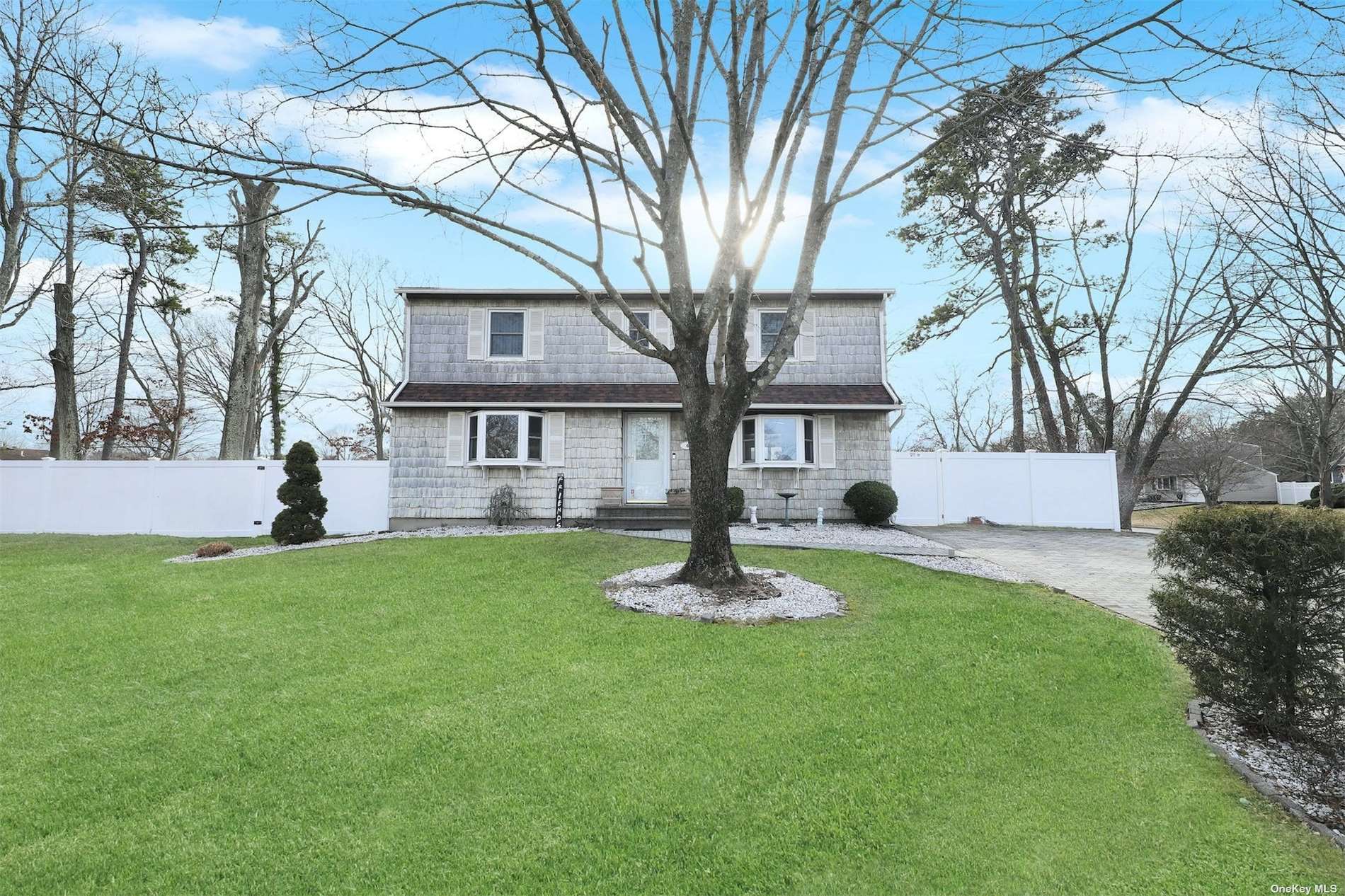 4 Rustic Gate Ridge, NY 11961 - Photo 1 of 1 a front view of a house with a yard