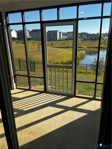 a view of a door and a window