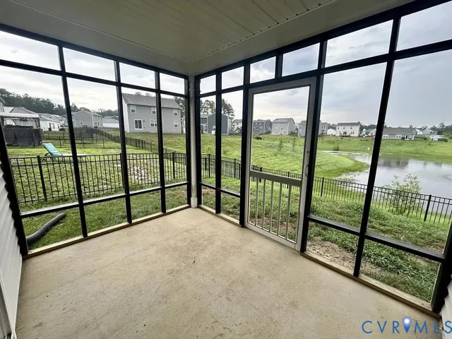 an empty room with sliding glass door