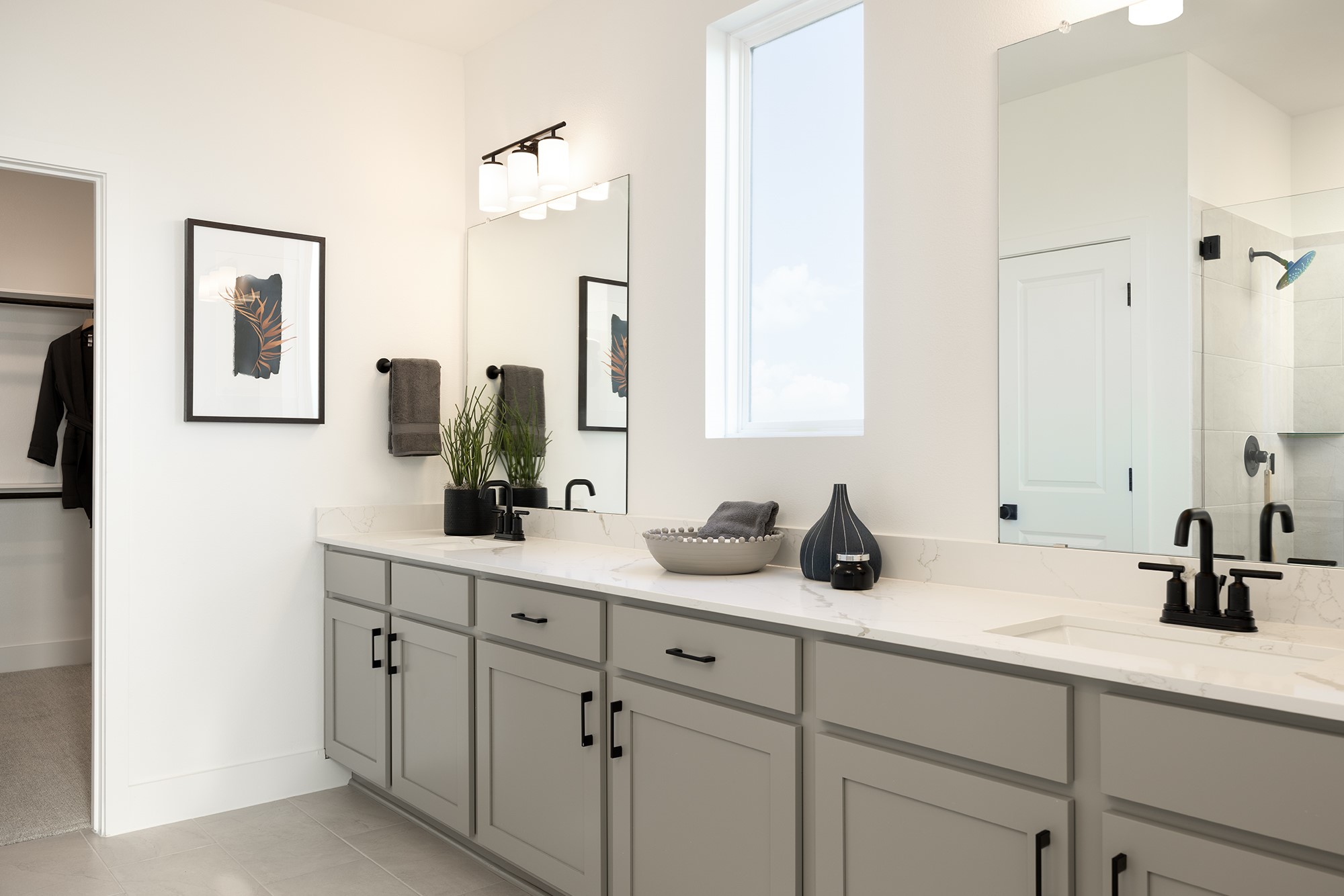 270 Romans Road Kyle, TX 78640 - Photo 7 of 23 a bathroom with a double vanity sink and a mirror