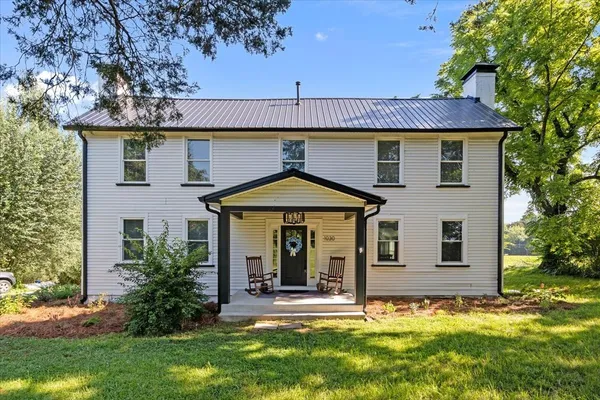 front view of a house with a yard