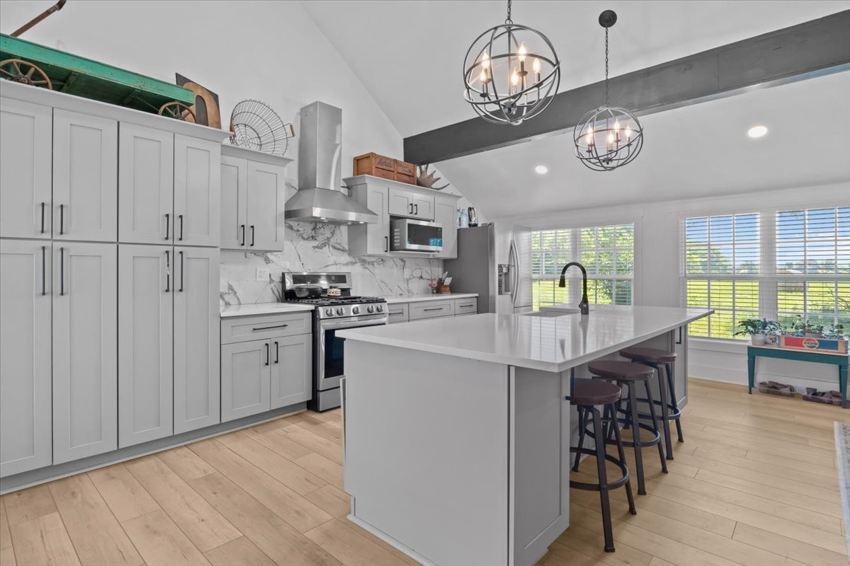 1030 Upper Creek Road Vanleer, TN 37181 - Photo 13 of 38 a kitchen with cabinets and stainless steel appliances
