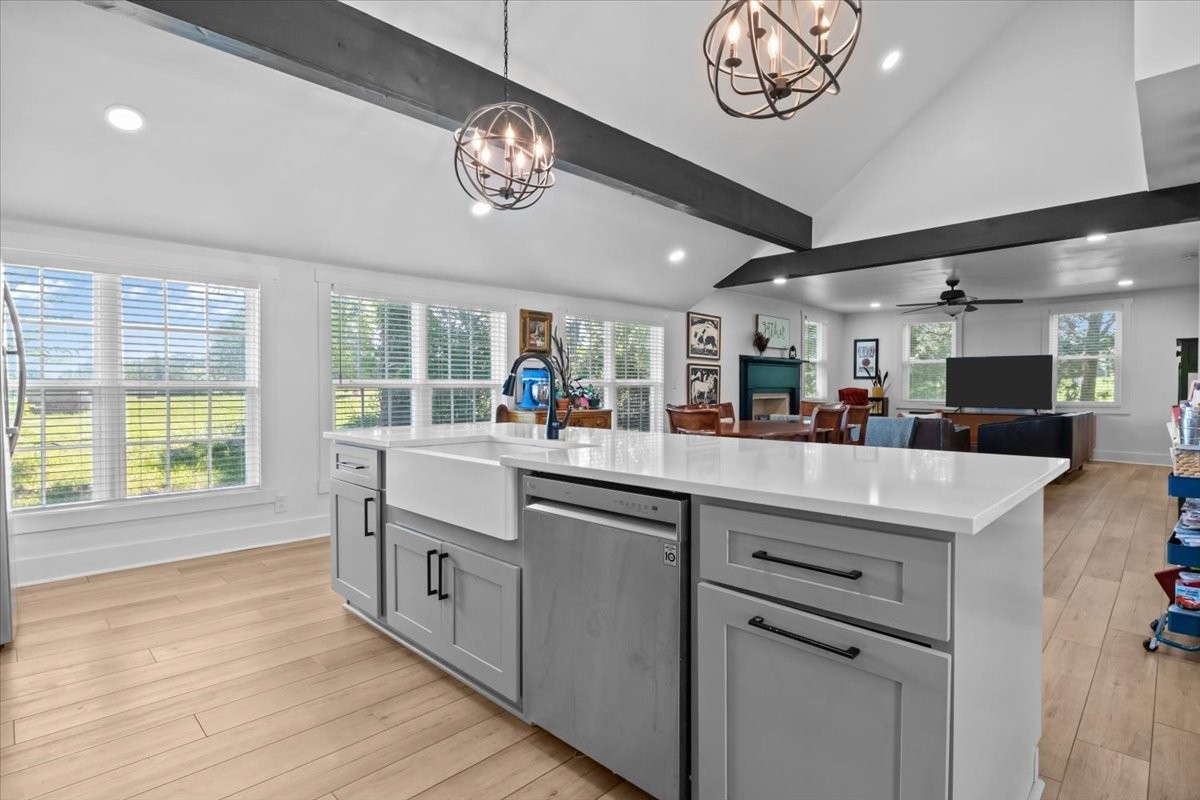 1030 Upper Creek Road Vanleer, TN 37181 - Photo 14 of 38 a kitchen with cabinets a window and a chandelier