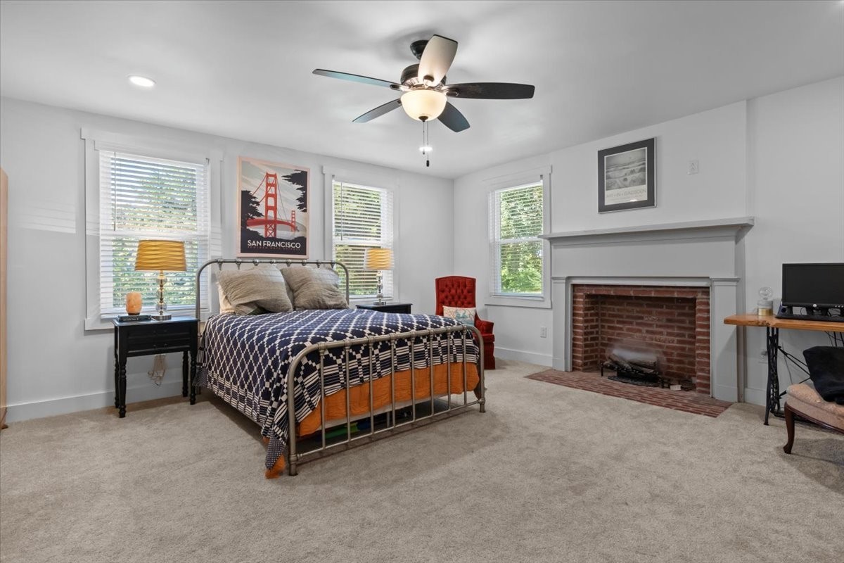 1030 Upper Creek Road Vanleer, TN 37181 - Photo 17 of 38 a bedroom with a bed and a fireplace