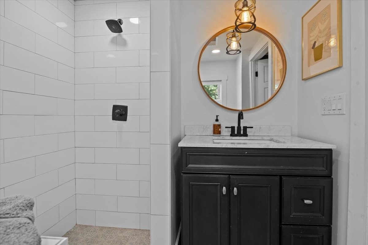 1030 Upper Creek Road Vanleer, TN 37181 - Photo 20 of 38 a bathroom with a sink a vanity and a mirror