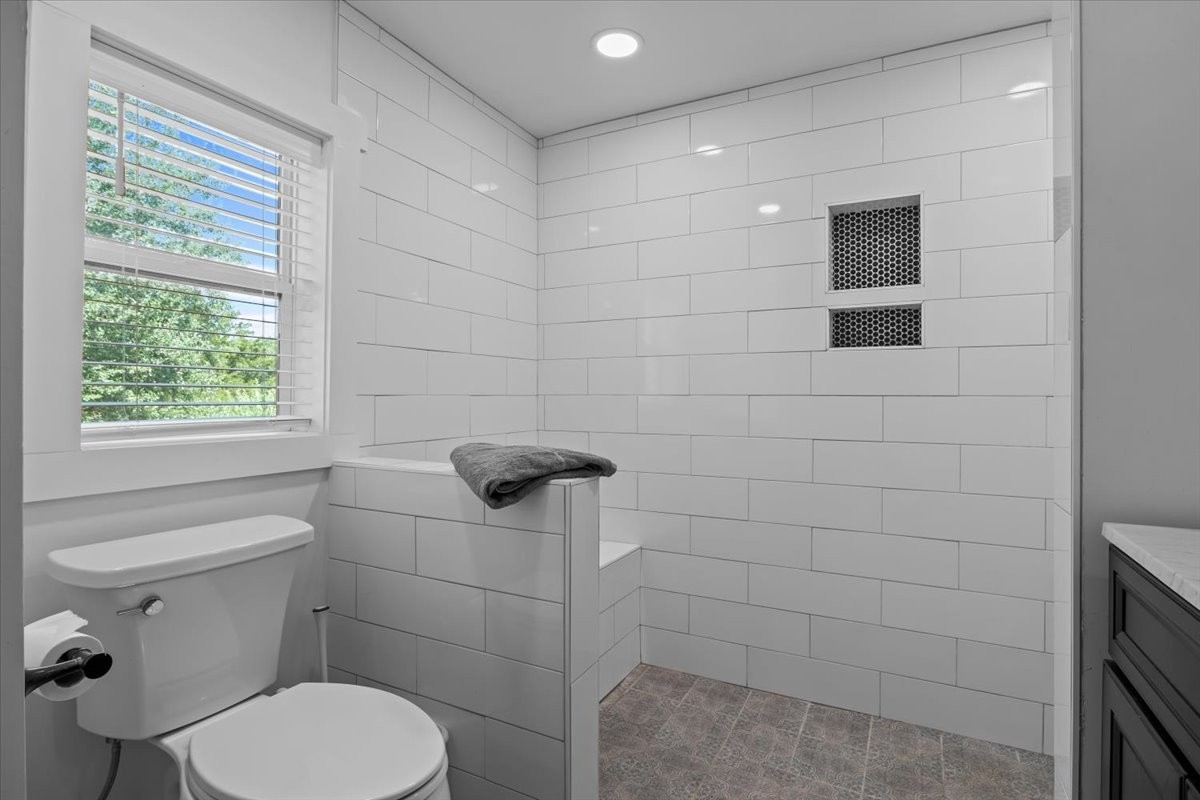 1030 Upper Creek Road Vanleer, TN 37181 - Photo 21 of 38 a white toilet sitting next to a bathroom sink