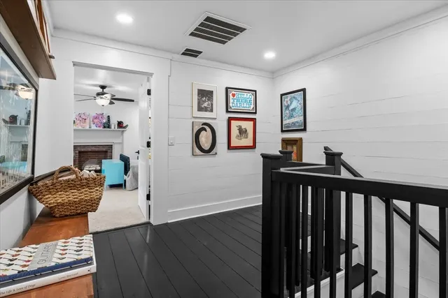 a bedroom with furniture and wooden floor