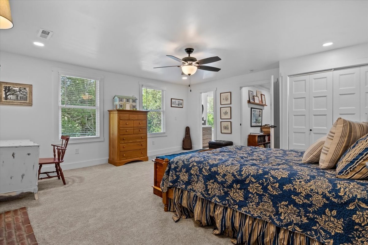 1030 Upper Creek Road Vanleer, TN 37181 - Photo 24 of 38 a bedroom with a bed and a chandelier