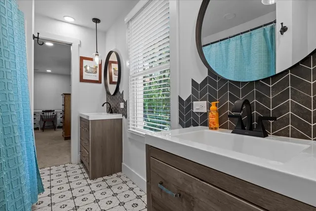 a bathroom with a sink and a mirror