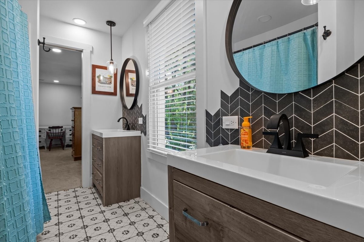 1030 Upper Creek Road Vanleer, TN 37181 - Photo 25 of 38 a bathroom with a sink and a mirror