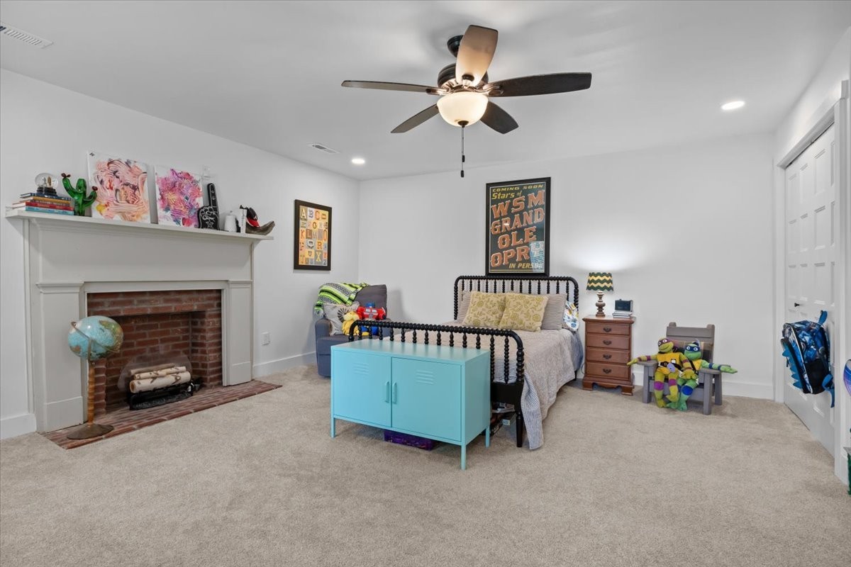 1030 Upper Creek Road Vanleer, TN 37181 - Photo 26 of 38 a bedroom with a bed and a fireplace