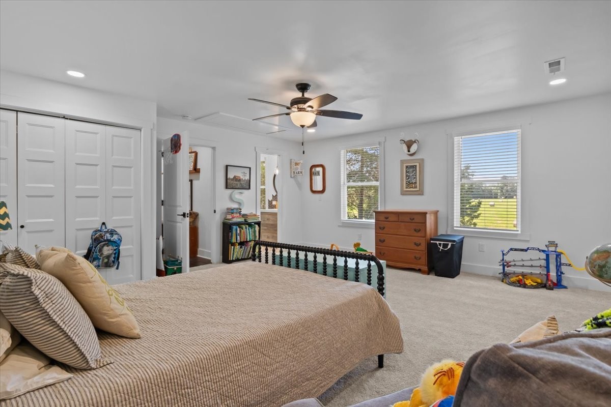 1030 Upper Creek Road Vanleer, TN 37181 - Photo 27 of 38 a bedroom with a bed and a chandelier