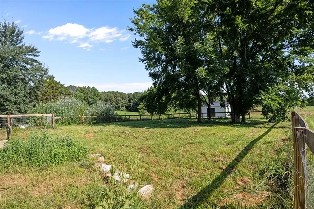a view of a lake with a yard