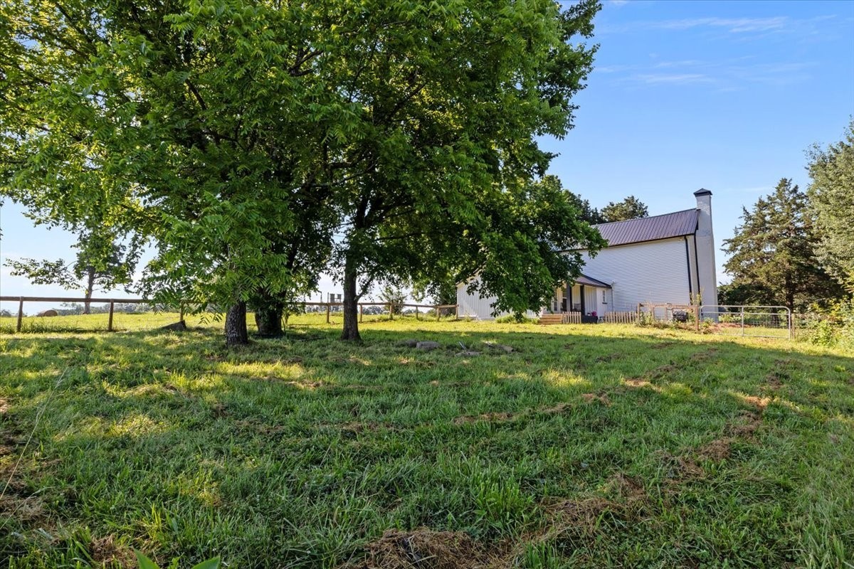 1030 Upper Creek Road Vanleer, TN 37181 - Photo 30 of 38 a view of backyard with large trees and plants