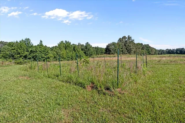 a view of a lake with a big yard