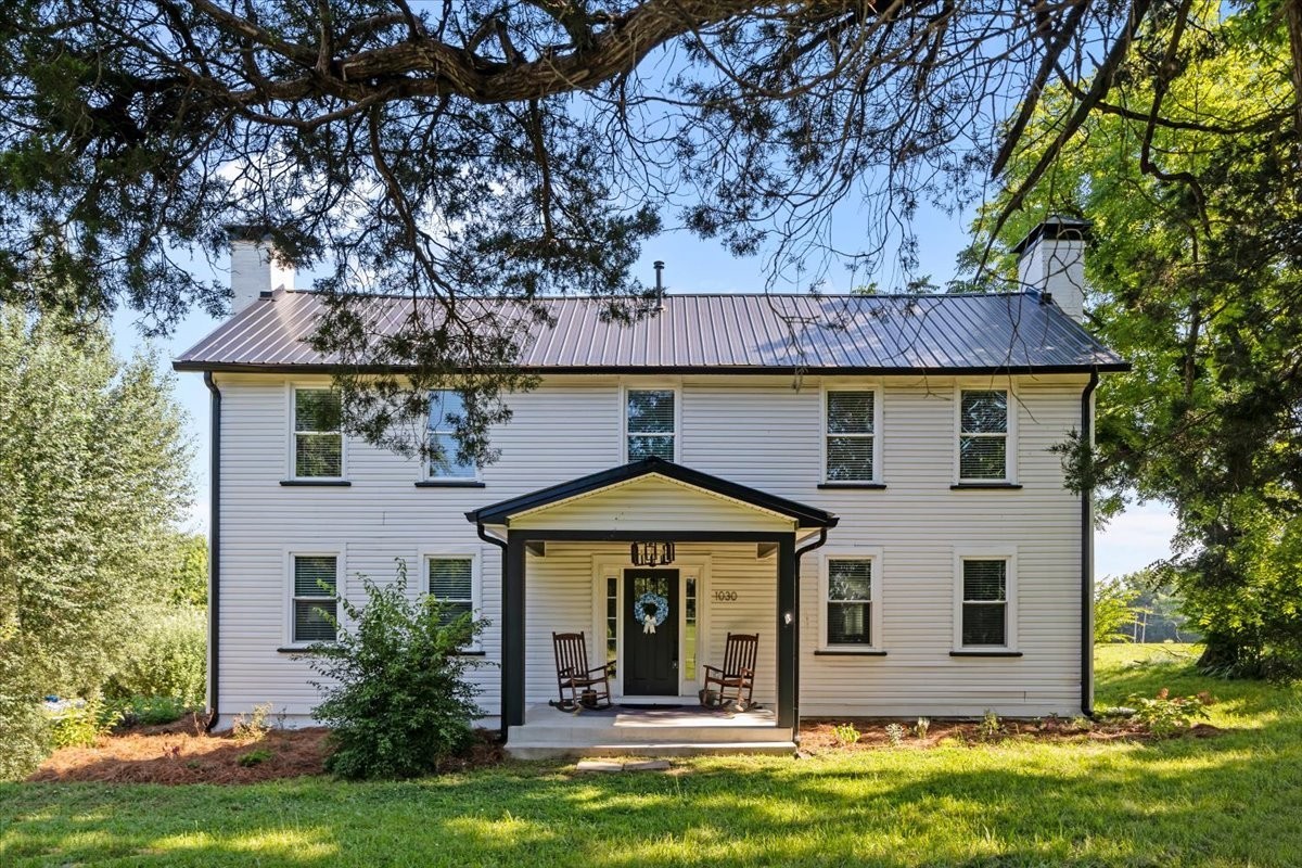 1030 Upper Creek Road Vanleer, TN 37181 - Photo 33 of 38 a front view of a house with garden